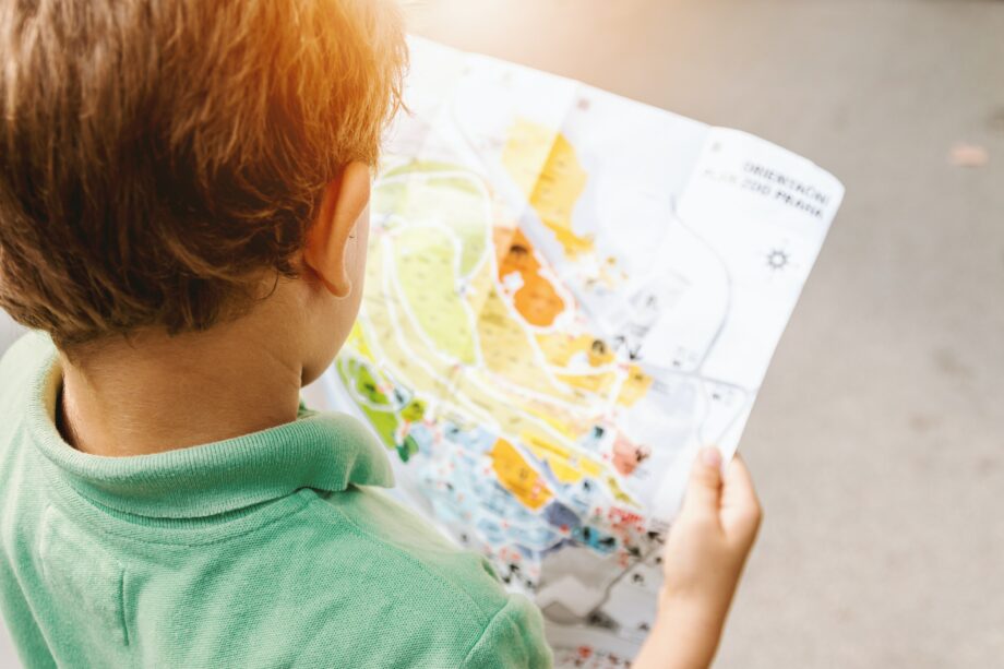 A boy reading a map